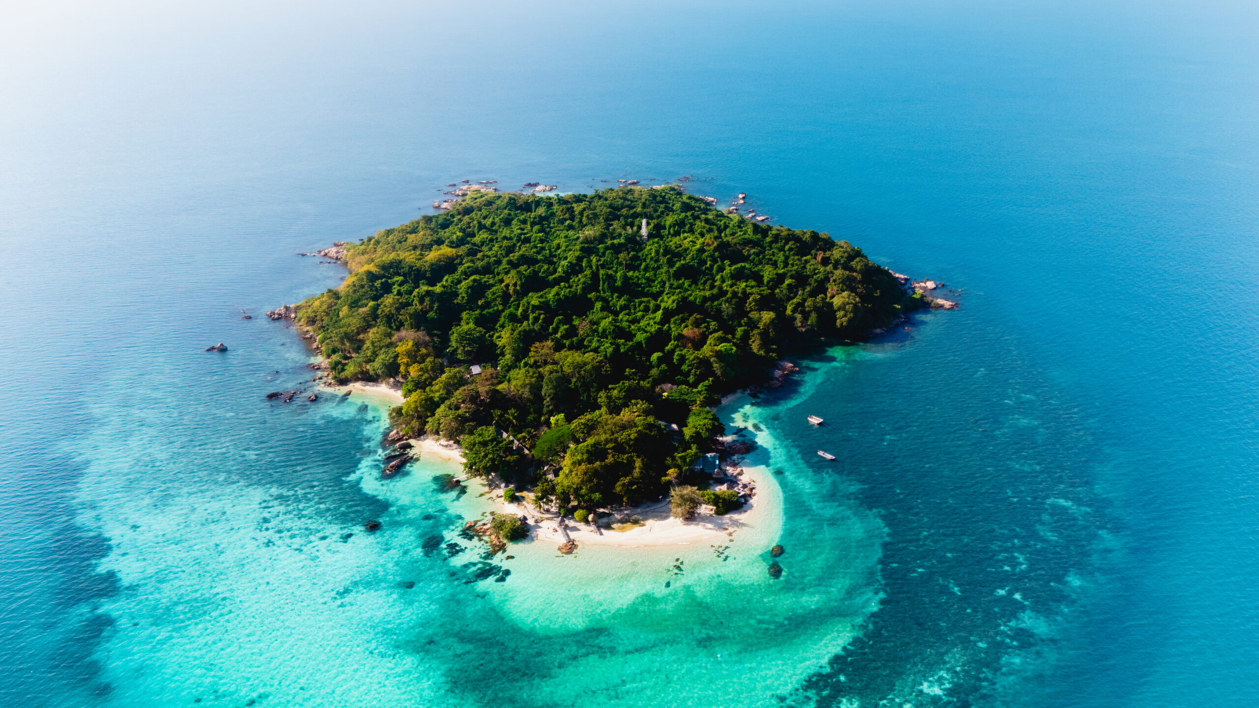 Small Thai island surrounded by tropical sea